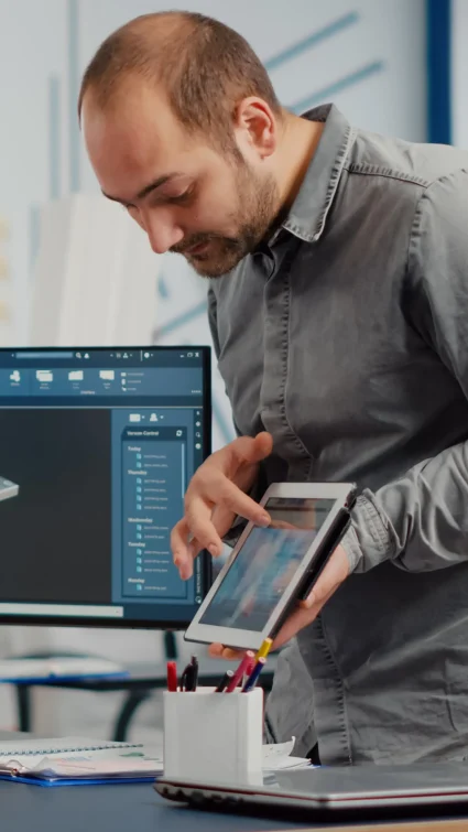 Business consultant analyzing data on tablet in modern office